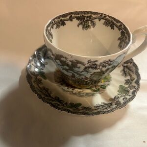 Myott transferware teacup and saucer with pastoral scene.
